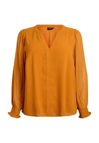 Senfgelbe Bluse mit V-Ausschnitt, langen durchsichtigen Ärmeln mit schmalen Bündchen und einem lässigen Schnitt. Hergestellt aus leichtem Stoff mit glatter Textur.