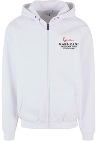 Felpa bianca con zip, realizzata in cotone, con cappuccio regolabile, tasche frontali e logo ricamato in rosso e nero.
