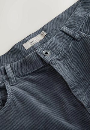 Gray corduroy pants with straight fit design, featuring a sturdy waistband, metal button closure, and textured, ribbed fabric.