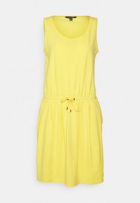 Gul ärmlös klänning i en mjuk bomullsblandning, med ett elastiskt midjeband och dragsko samt subtila veck i kjolen.