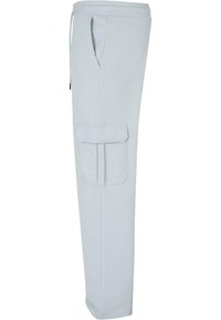 Light gray cargo pants in soft fabric, featuring side pockets and an elastic waistband with drawstrings. Straight leg design with a smooth texture.