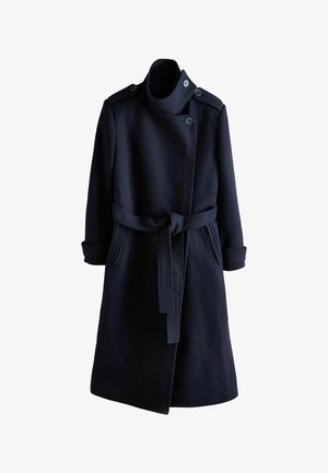 Navy wool blend coat featuring a high collar, buttoned shoulder accents, side pockets, and a belt at the waist. Tailored fit, mid-length design.