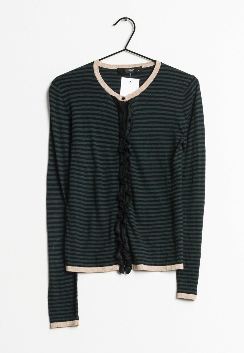 Striped cardigan in dark green and black, featuring a beige collar, ruffled front design, and long sleeves. Hanging on a black hook.