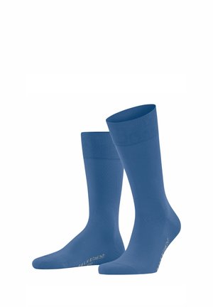 Blauwe katoenen sokken met een gladde textuur, geribbelde boordjes en verstevigde tenen en hakken. Lichtgewicht ontwerp voor comfort en ademend vermogen.