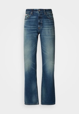 Siniset farkut suoran mitoituksen kanssa, keskipestyt, kuluneet yksityiskohdat, viisi taskua ja nappikiinnitys. Erosit stitching saumoissa.