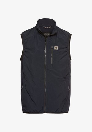 Gilet sans manches bleu marine avec un col montant, fermeture éclair à l'avant et deux poches latérales, fabriqué en tissu léger au toucher doux.