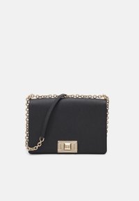 Black leather crossbody bag with a gold chain strap and a rectangular clasp featuring a square detail, set against a white background.