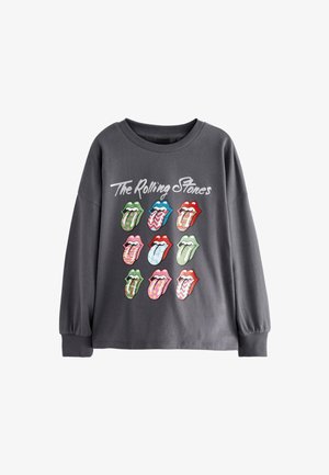 Chemise à manches longues grise avec des logos de langue colorés disposés en grille, avec le texte "The Rolling Stones" au-dessus. Matière en coton douce.