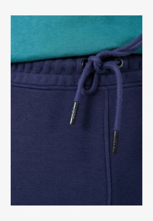 Marineblaue Sweatpants mit einem Kordelzug an der Taille, ausgestattet mit einer weichen Textur und verstärkten Nähten entlang der Säume.