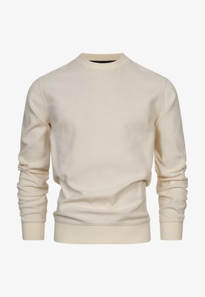 Crèmekleurige trui met een gestructureerd patroon, ronde halslijn en geribbelde boorden en zoom, gemaakt van een zachte stof.
