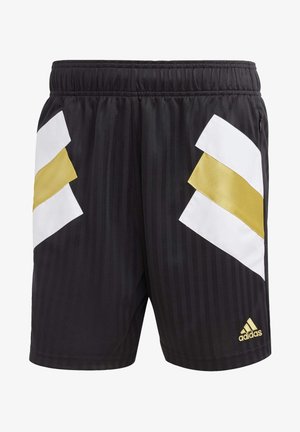 Zwarte sportshorts met witte en gouden chevronstrepen aan de zijkanten, elastische tailleband en klein goudkleurig Adidas-logo rechtsonder.