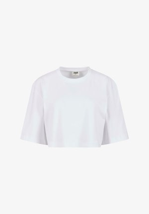 Valge lühikeste varrukatega lühendatud T-särk, mis on valmistatud pehmest puuvillast. Omab ümarat kaelust ja vaba lõiget, ilma nähtavate mustrite või metalldetailideta.