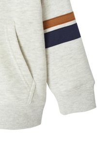 Gray sweatshirt sleeve with a pocket, featuring brown and navy horizontal stripes, ribbed cuffs, and soft texture.