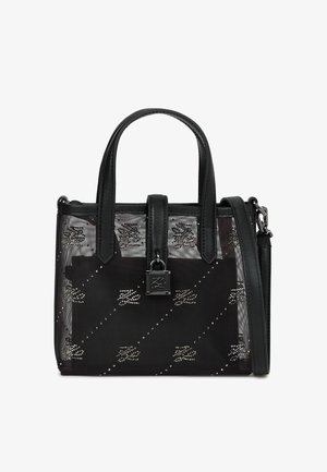 Czarna torebka na ramię z przezroczystą siateczką, skórzanymi akcentami, górnymi uchwytami oraz odpinanym paskiem na ramię. Posiada srebrne elementy i wzory.