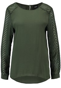 Blusa a maniche lunghe di colore verde scuro con maniche trasparenti a motivo chevron e scollatura rotonda, chiusura con cerniera sul retro.