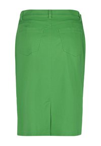 Grön knälång kjol med bakfickor, bälteshällor och en liten slits mitt baktill.