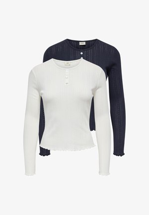 Dva gornja dijela s dugim rukavima, jedan bijeli, a jedan tamnoplavi, s rebrastom teksturom, kopčanjem na gumbe sprijeda i detaljem valovitog ruba.