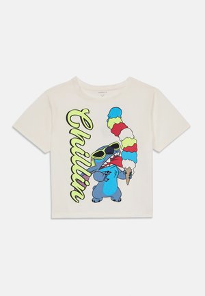 Short-sleeve cream cotton t-shirt featuring a blue cartoon character holding an ice cream cone with colorful scoops. Text reads "Chillin."