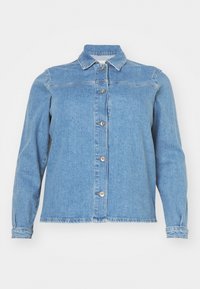 Gaišs zila džinsa jaka ar apkakli, garām piedurknēm, priekšējo pogu aizdari un divām krūšu kabatām. Iezīmē nedaudz nolietotu apakšmalu.