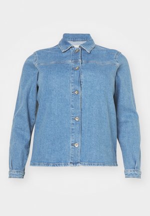 Gaišs zila džinsa jaka ar apkakli, garām piedurknēm, priekšējo pogu aizdari un divām krūšu kabatām. Iezīmē nedaudz nolietotu apakšmalu.