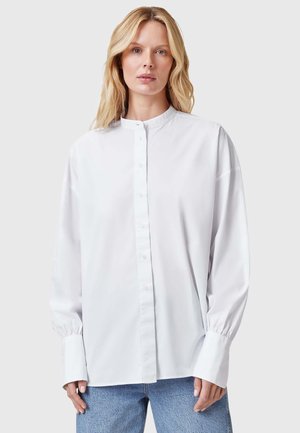 Witte button-up shirt van gladde stof, met een Mandarin-kraag, lange mouwen met manchet-details en een relaxte pasvorm.