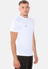 White short-sleeve T-shirt made of smooth fabric, featuring a round neck and a small gray logo on the left chest area.