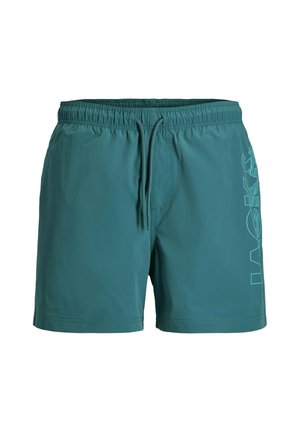 Short de bain bleu sarcelle avec ceinture élastique et cordon de serrage, présentant un motif graphique vertical subtil sur la cuisse droite.
