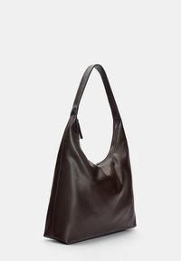 Leather shoulder bag in dark brown, featuring a smooth texture and a curved design with a single handle and zip closure.