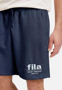 Fila LOUDI GRAPHIC   - Träningsbyxor - black iris