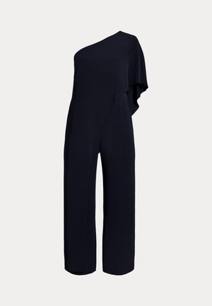 Salopetă de marină cu design asimetric pe un umăr, prezintă un drapaj moale și picioare largi. Fabricată din țesătură ușoară cu o textură fină.