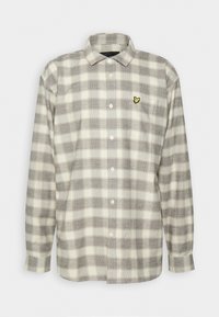 Koszula z długim rękawem na guziki w szaro-białą kratę, z ostrym kołnierzykiem i małym żółtym logo ptaka na kieszeni na piersi.