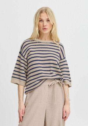 Maglione a righe in beige e blu navy, con un ampio scollo e una vestibilità rilassata. Progettato con maniche corte e dettagli testurizzati.