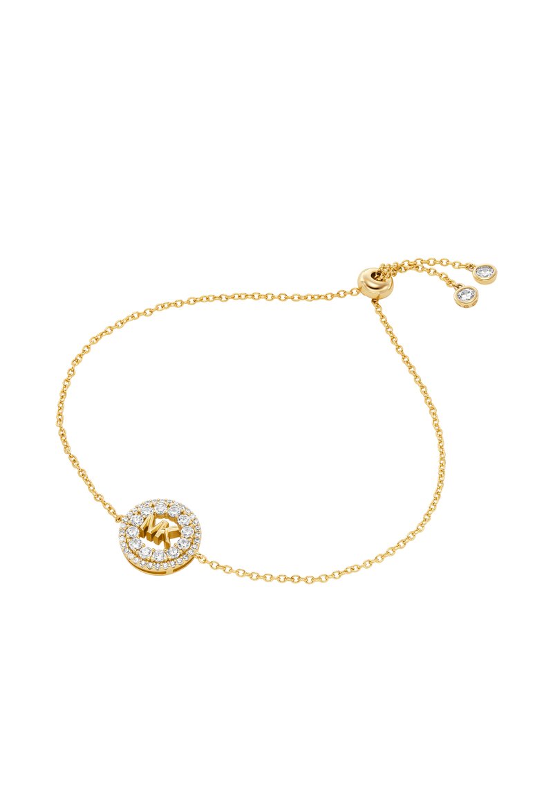 Bracciale in oro con un centro circolare, adornato da un alone di gemme trasparenti e un dettaglio in oro testurizzato al centro.