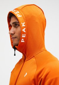 Peak Performance M RIDER - Sportinė striukė - dunkelorange