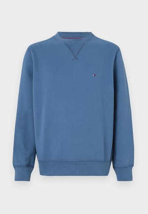 Sudadera azul de algodón con mangas largas, cuello redondo y detalle de costura en el cuello. Presenta un pequeño logo en el pecho.
