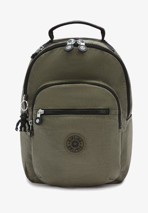 Kipling backpack in olive green nylon, featuring a rounded shape, top handle, multiple zippered pockets, and a monkey keychain accent.