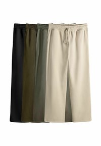 Kurze Sweatshorts in Schwarz, Dunkelgrün, Olivgrün und Beige. Aus glattem Stoff mit einem elastischen Bund und Kordelzug.