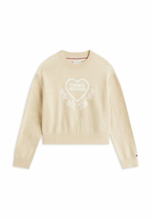 Pull court beige en matériau doux et texturé. Présente un cœur blanc avec "TOMMY HILFIGER" et des accents floraux au centre.
