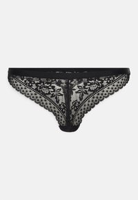 Svart spetsstrumpbyxa med blommönster, scallopade kanter och en mjuk midja. Materialet är genomskinligt, vilket framhäver den känsliga designen.