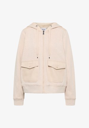 Jasnobeżowa bluza z kapturem na zamek błyskawiczny, wyposażona w dwie naszywane kieszenie z przodu, sznurki do ściągania oraz ściągacze na mankietach. Miękka w dotyku.