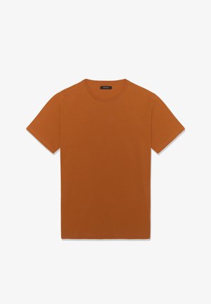 Short-sleeve, crew neck t-shirt in burnt orange cotton fabric, featuring a clean design and smooth texture, with minimal stitching details.