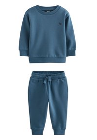Survêtement en coton bleu composé d'un sweat-shirt à col rond avec poignets côtelés et d'un pantalon assorti à taille élastique et poches latérales.