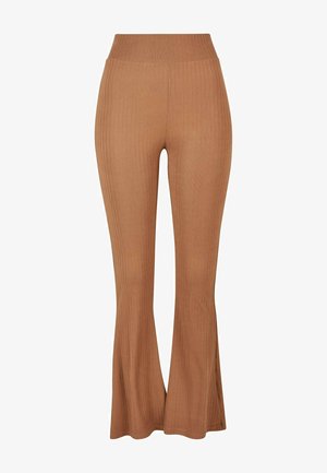 Brown ribbed trousers with a flared bottom and wide waistband, made from a soft, stretchy material, featuring vertical ribbing detail.