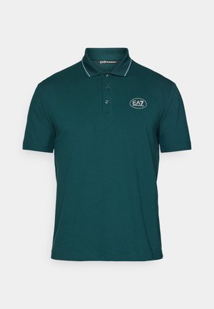 Polo-Shirt aus dunkelgrünem Baumwollstoff mit einer Knopfleiste mit drei Knöpfen, kurzen Ärmeln und einem kontrastierenden Kragenbesatz. Mit EA7-Logo.