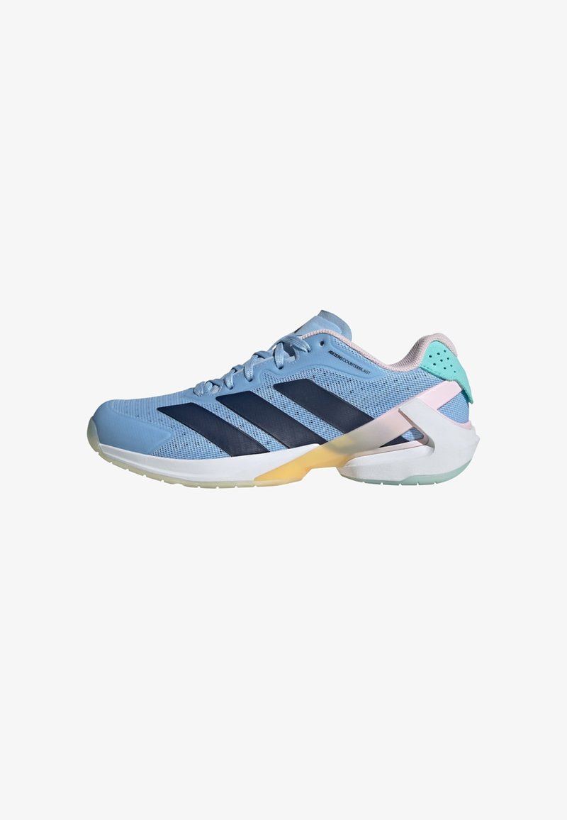 Light blue athletic shoe with navy stripes, mesh upper, padded collar, and a translucent sole featuring a yellow accent and a mint green heel.
