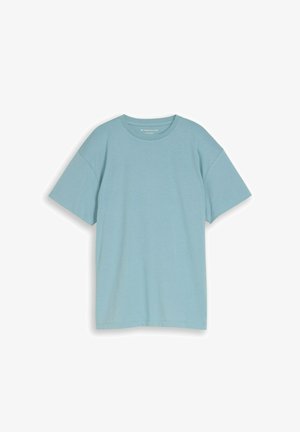 T-shirt azzurro chiaro a maniche corte con scollo a girocollo e vestibilità comoda, mostrata distesa su uno sfondo bianco.