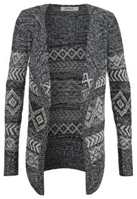 Svart och vit stickad cardigan med öppen framtill, långa ärmar och geometriska mönster. Tillverkad av ett texturerat tyg med varierande stickstilar.