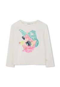 Chemise blanche à manches longues avec un grand visage de cochon en sequins portant un chapeau de cow-boy turquoise et de grands cils sur le devant.