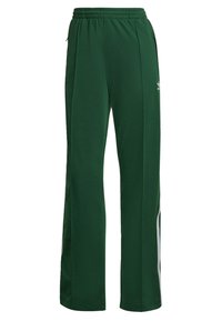 Tummanvihreät verkkarit, kevyestä kankaasta valmistetut. Niissä on joustava vyötärönauha, sivutaskut ja valkoiset raidat sivuilla.