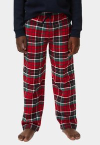 Rote Karo-Pyjama-Hosen aus weichem Stoff, mit schwarzen, grünen und weißen Linien in einem karierten Muster. Elastischer Bund mit Kordelzug.